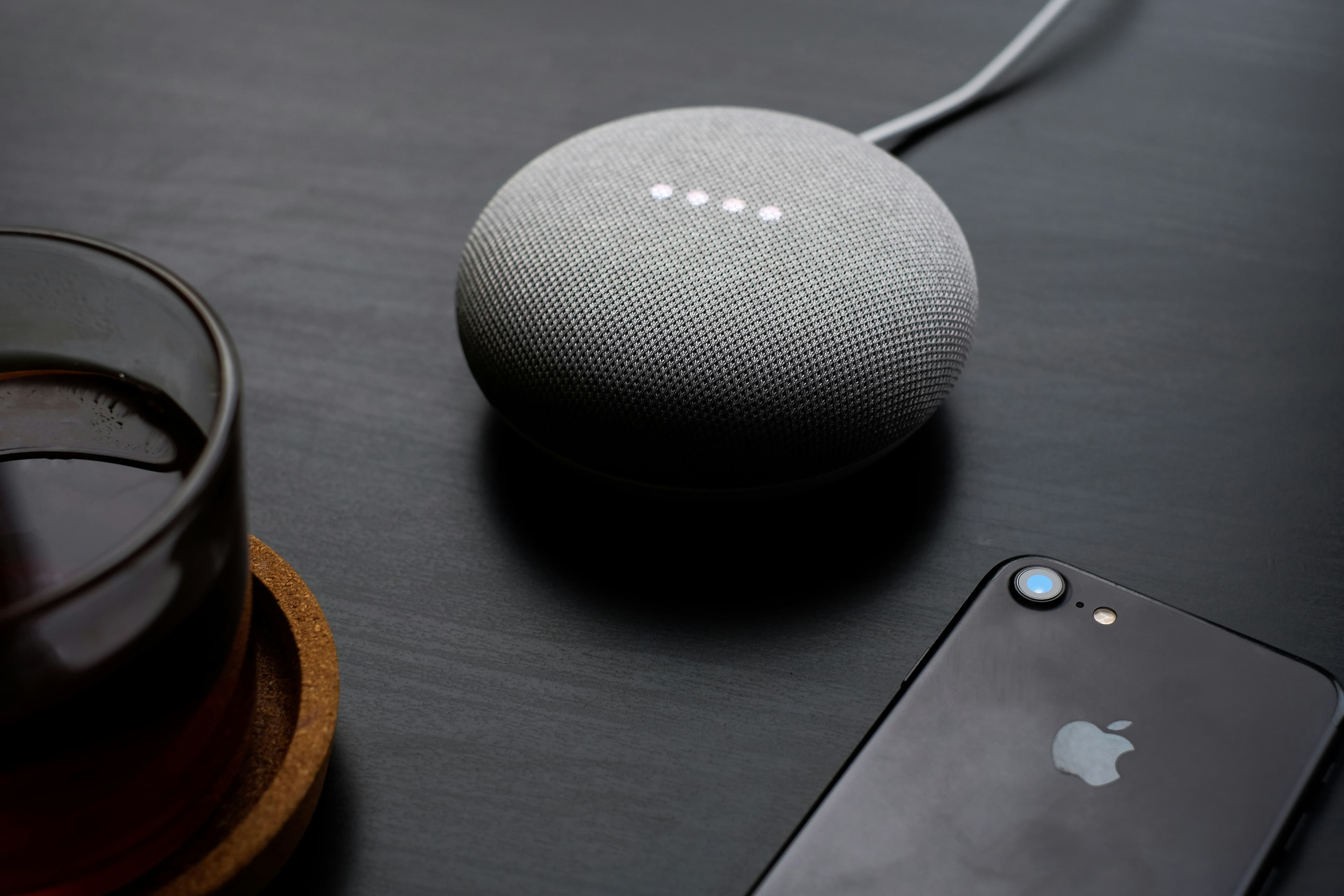 Collage of modern senior care technologies: tablet, sensor, smart speaker