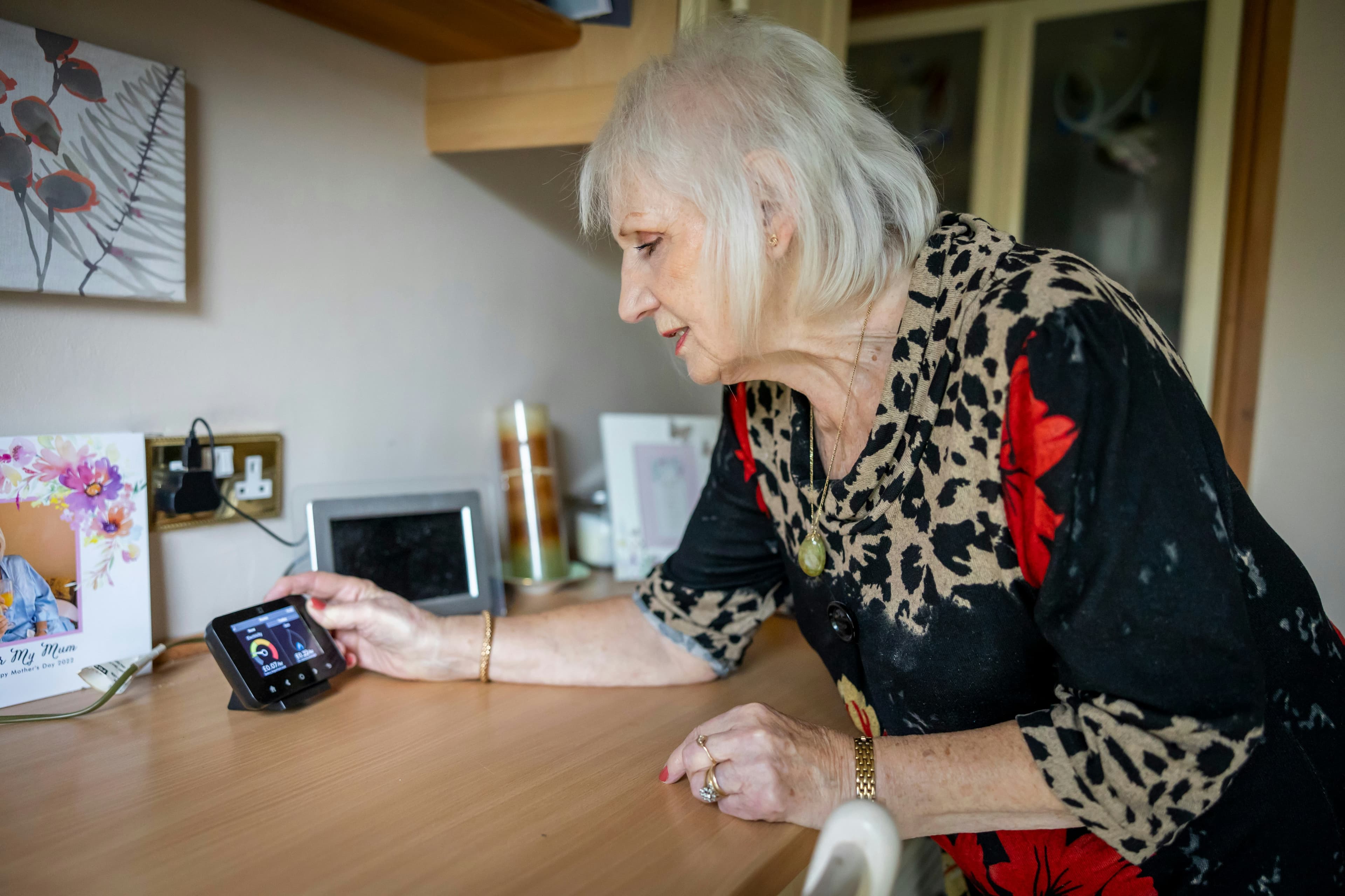 Resident speaking with family on a video call device